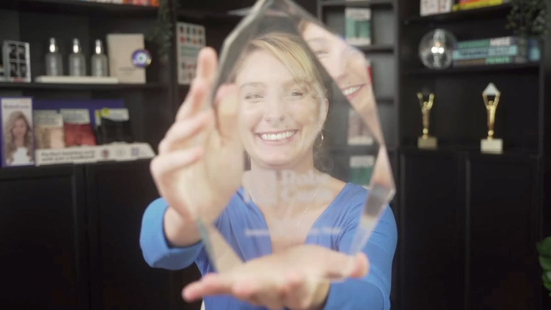 Emily Kenison holding the 2022 Beauty Innovation Award for Hair Care Innovation